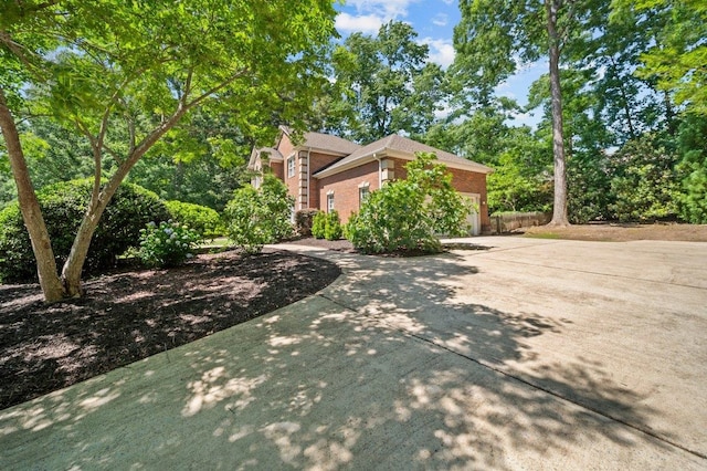 155 Lake Park Dr, Spartanburg, SC 29301 - view of home's exterior with brick siding, concrete driveway, and a garage