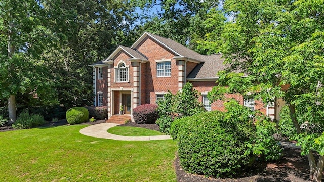 155 Lake Park Dr, Spartanburg, SC 29301 - georgian-style home with brick siding and a front yard