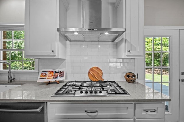 155 Lake Park Dr, Spartanburg, SC 29301 - kitchen with wall chimney exhaust hood, appliances with stainless steel finishes, white cabinets, and tasteful backsplash