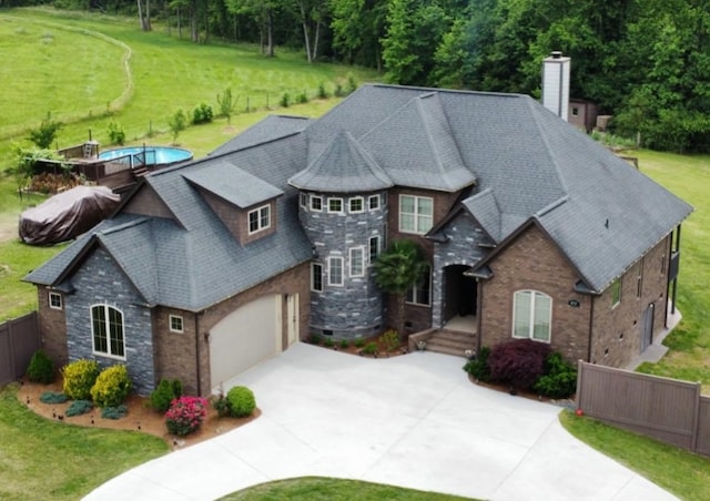 473 Meadow Rd, Inman, SC 29349 - french country style house with stone siding, concrete driveway, a chimney, and a shingled roof