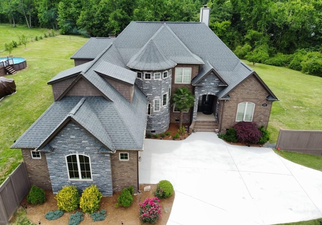 473 Meadow Rd, Inman, SC 29349 - view of front of house featuring stone siding, a chimney, and roof with shingles