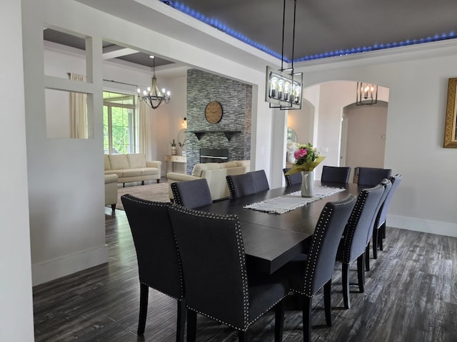 473 Meadow Rd, Inman, SC 29349 - dining area with a chandelier, dark wood-style floors, a fireplace, and a tray ceiling
