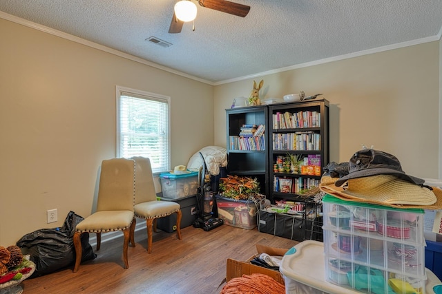 1762 New Cut Rd, Spartanburg, SC 29303 - sitting room featuring wood finished floors, ornamental molding, ceiling fan, and a textured ceiling