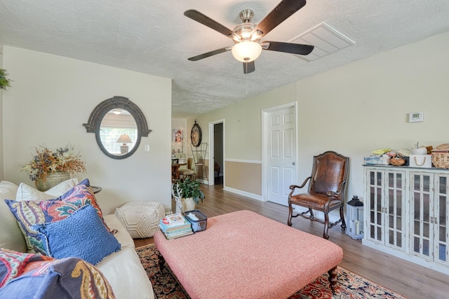 1762 New Cut Rd, Spartanburg, SC 29303 - living room with ceiling fan, wood finished floors, and a textured ceiling