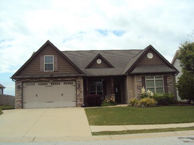 108 Dewfield Ln, Boiling Springs, SC 29316 - craftsman inspired home with concrete driveway, a front yard, stone siding, and a garage