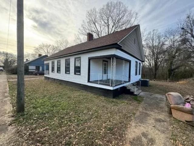 1145 Granite St, Pacolet, SC 29372 - view of side of home featuring covered porch and a chimney