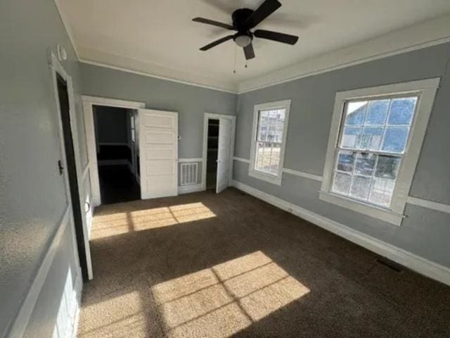 1145 Granite St, Pacolet, SC 29372 - unfurnished bedroom featuring carpet floors, multiple windows, and a ceiling fan