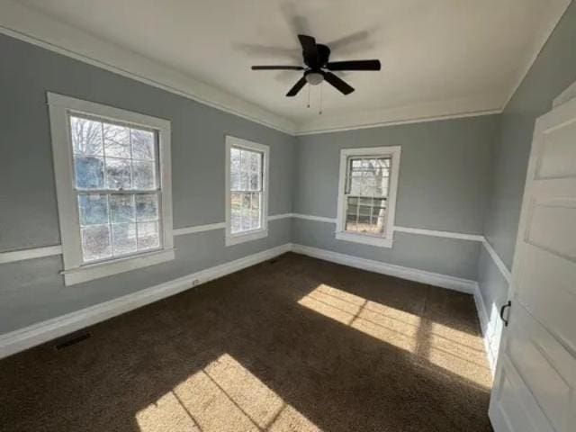 1145 Granite St, Pacolet, SC 29372 - empty room with dark carpet, a ceiling fan, and crown molding