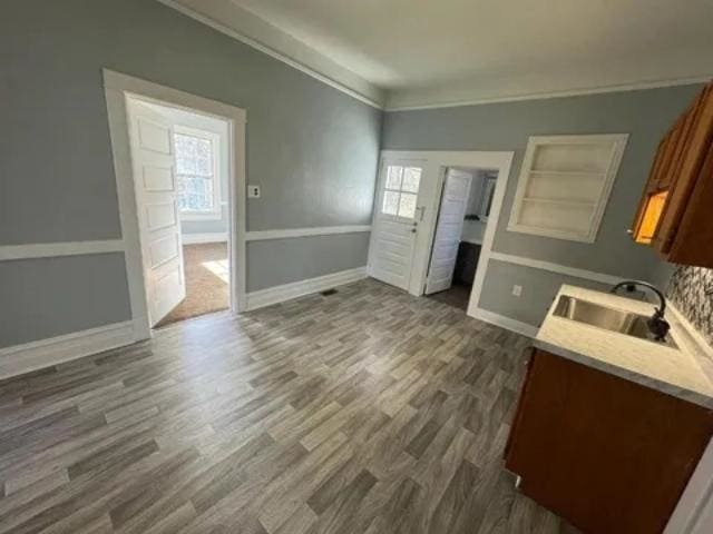 1145 Granite St, Pacolet, SC 29372 - kitchen featuring healthy amount of natural light, dark wood finished floors, light countertops, and crown molding