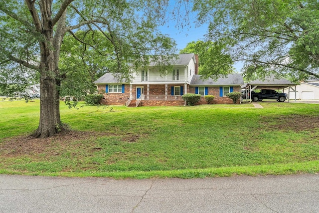 125 Greenway Ave, Union, SC 29379 - traditional home featuring brick siding, a carport, a front lawn, and a chimney