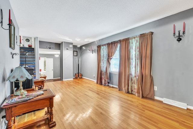 125 Greenway Ave, Union, SC 29379 - living room with light wood-style floors and a textured ceiling
