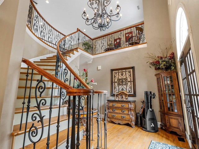458 Carolina Club Dr, Spartanburg, SC 29306 - stairway with a towering ceiling, wood finished floors, a chandelier, and recessed lighting