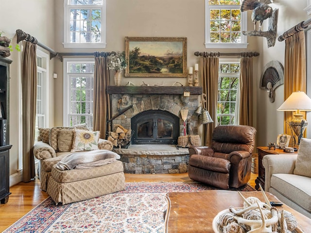 458 Carolina Club Dr, Spartanburg, SC 29306 - living room with wood finished floors, a stone fireplace, and a high ceiling
