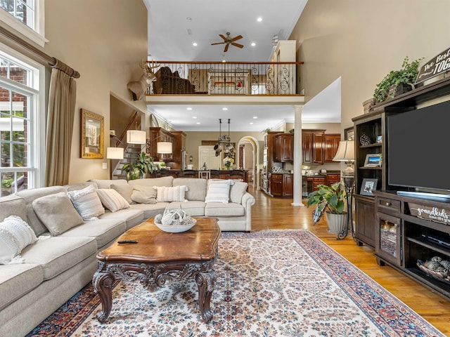 458 Carolina Club Dr, Spartanburg, SC 29306 - living area with a high ceiling, ceiling fan, light wood-style flooring, crown molding, and recessed lighting