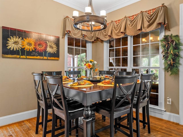 458 Carolina Club Dr, Spartanburg, SC 29306 - dining space featuring a chandelier, crown molding, wood finished floors, and healthy amount of natural light