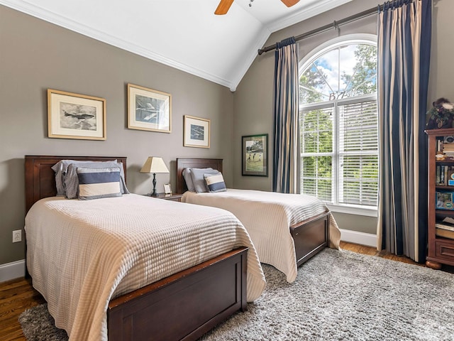 458 Carolina Club Dr, Spartanburg, SC 29306 - bedroom with crown molding, vaulted ceiling, multiple windows, wood finished floors, and a ceiling fan
