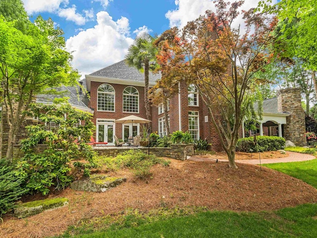 458 Carolina Club Dr, Spartanburg, SC 29306 - view of front of house with french doors, a shingled roof, and brick siding