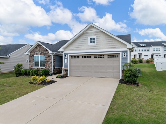 514 Olivia Springs Dr, Spartanburg, SC 29302 - craftsman-style house with stone siding, a garage, driveway, and a front lawn