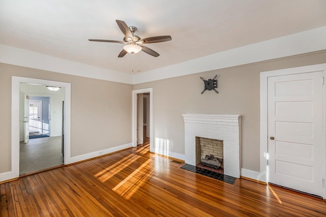 91 Lawrence St, Lyman, SC 29365 - unfurnished living room with hardwood / wood-style floors, a ceiling fan, and a fireplace