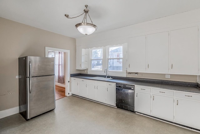 91 Lawrence St, Lyman, SC 29365 - kitchen featuring freestanding refrigerator, dishwasher, dark countertops, white cabinetry, and healthy amount of natural light