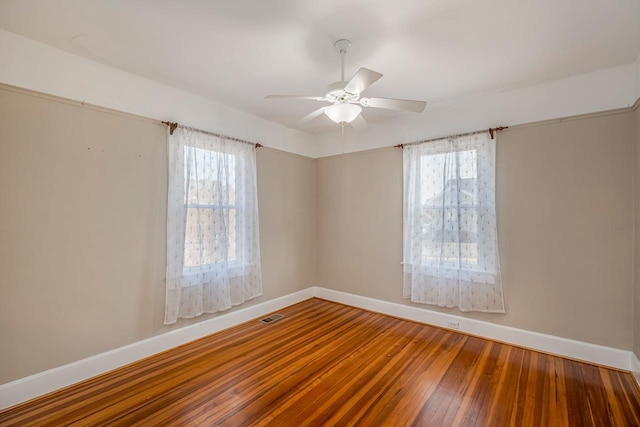 91 Lawrence St, Lyman, SC 29365 - empty room featuring plenty of natural light, hardwood / wood-style floors, and a ceiling fan