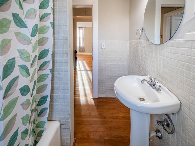 91 Lawrence St, Lyman, SC 29365 - bathroom featuring wood finished floors, tile walls, shower / bath combo, and wainscoting