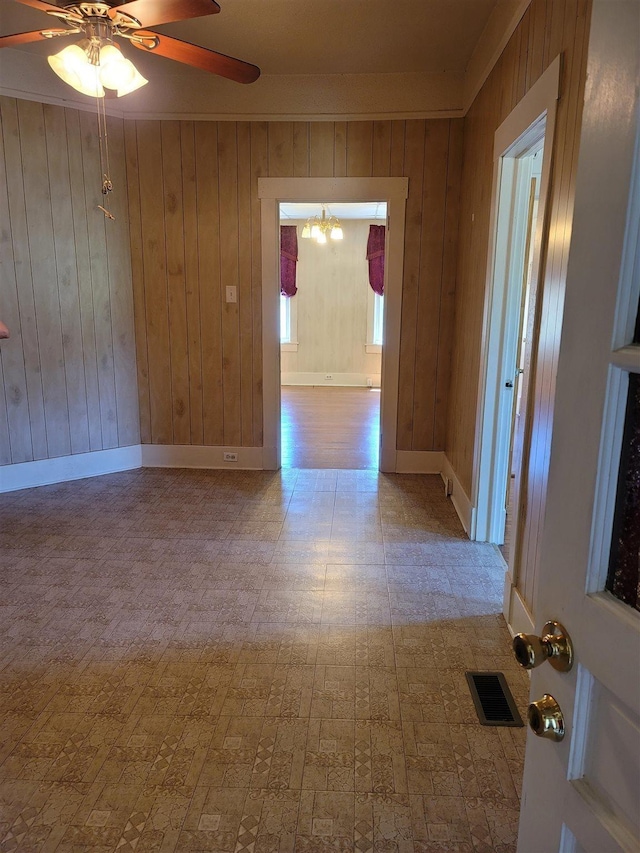 225 Limestone St, Pacolet, SC 29372 - unfurnished room with ceiling fan, wood walls, and a chandelier