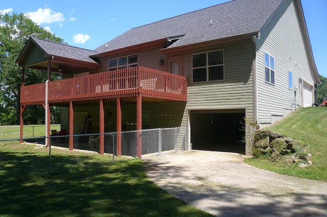 415 Abernathy Rd, Inman, SC 29349 - back of property featuring a garage, concrete driveway, a deck, and roof with shingles