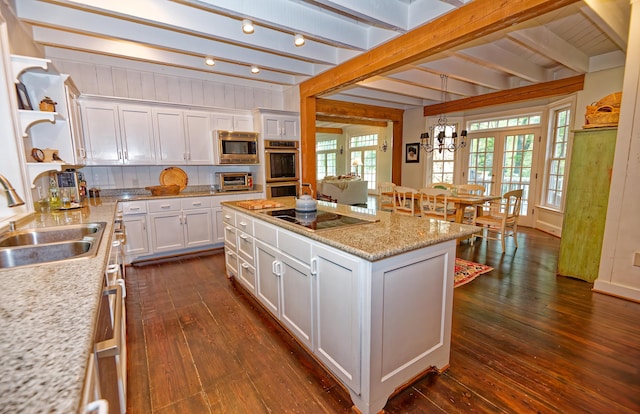 735 Jackson Grove Rd, Landrum, SC 29356 - kitchen with open shelves, beam ceiling, appliances with stainless steel finishes, white cabinetry, and dark wood-style flooring