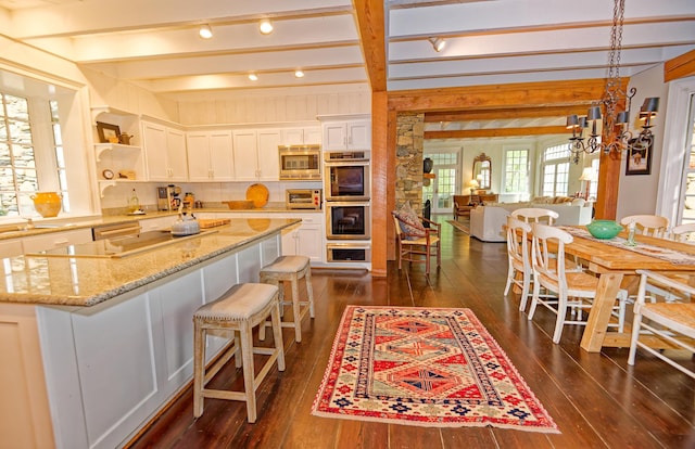 735 Jackson Grove Rd, Landrum, SC 29356 - kitchen featuring appliances with stainless steel finishes, dark wood-style flooring, open shelves, white cabinets, and beam ceiling