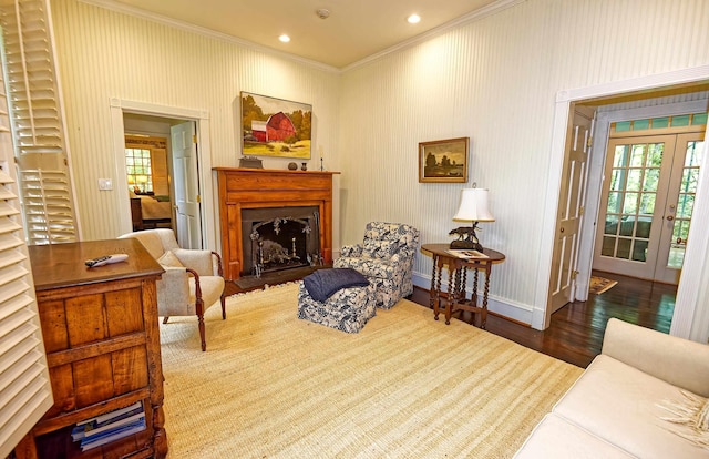 735 Jackson Grove Rd, Landrum, SC 29356 - living area featuring crown molding, wood finished floors, a fireplace with raised hearth, plenty of natural light, and french doors