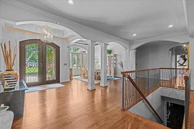 135 Neal Pointe Dr, Chesnee, SC 29323 - entryway with french doors, wood finished floors, crown molding, arched walkways, and ornate columns