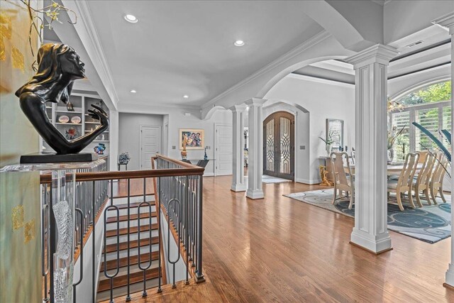 135 Neal Pointe Dr, Chesnee, SC 29323 - hallway with decorative columns, arched walkways, wood finished floors, ornamental molding, and recessed lighting
