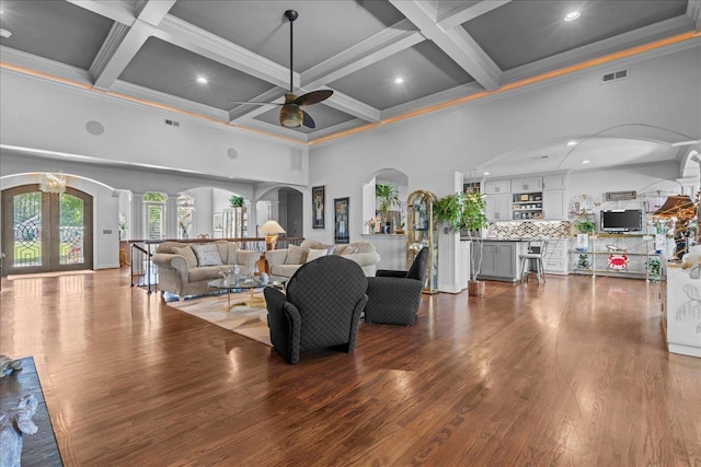 135 Neal Pointe Dr, Chesnee, SC 29323 - living area with a towering ceiling, arched walkways, ceiling fan, coffered ceiling, and crown molding