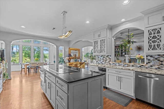 135 Neal Pointe Dr, Chesnee, SC 29323 - kitchen featuring stainless steel dishwasher, decorative columns, black electric cooktop, recessed lighting, and backsplash