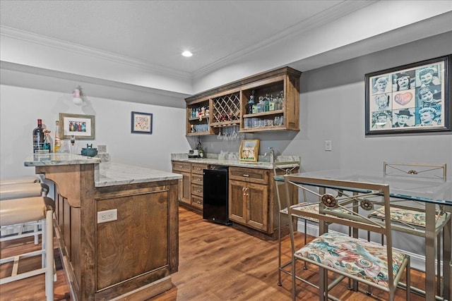 135 Neal Pointe Dr, Chesnee, SC 29323 - indoor wet bar with wood finished floors, ornamental molding, recessed lighting, and refrigerator
