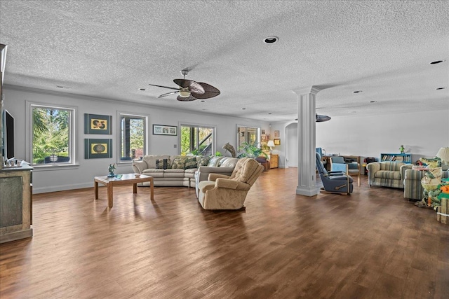 135 Neal Pointe Dr, Chesnee, SC 29323 - living room with ornate columns, a textured ceiling, a ceiling fan, and wood finished floors