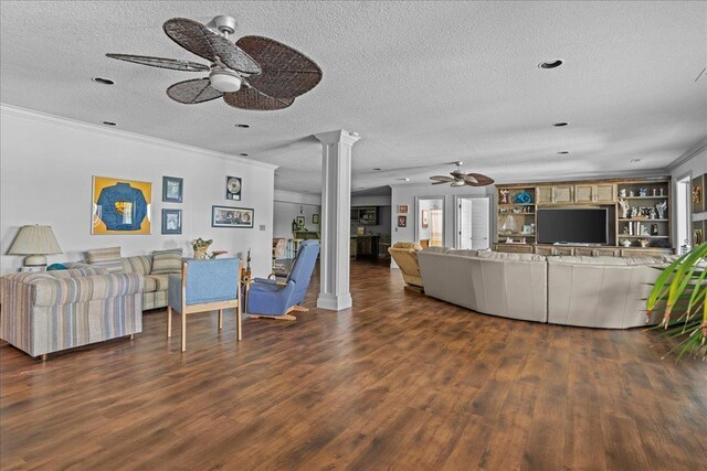 135 Neal Pointe Dr, Chesnee, SC 29323 - living area with a ceiling fan, ornate columns, a textured ceiling, ornamental molding, and dark wood-type flooring
