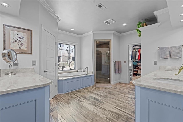 135 Neal Pointe Dr, Chesnee, SC 29323 - bathroom with a stall shower, crown molding, two vanities, recessed lighting, and a garden tub