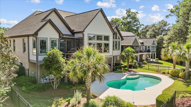 135 Neal Pointe Dr, Chesnee, SC 29323 - rear view of house featuring a sunroom, a fenced backyard, and a patio area