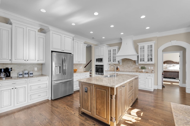 115 Gleneagles Rd, Campobello, SC 29322 - kitchen with stainless steel appliances, custom range hood, tasteful backsplash, ornamental molding, and a kitchen island with sink