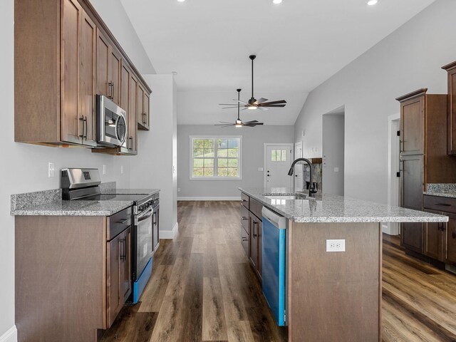 1328 Shoresbrook Rd, Spartanburg, SC 29301 - kitchen featuring stainless steel appliances, dark wood-style floors, lofted ceiling, an island with sink, and ceiling fan