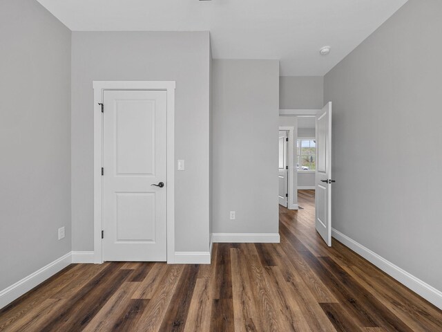 1328 Shoresbrook Rd, Spartanburg, SC 29301 - unfurnished bedroom with dark wood-style flooring and baseboards