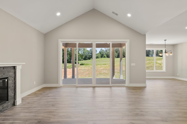 3135 E Croft Cir, Spartanburg, SC 29302 - unfurnished living room with a fireplace, a chandelier, recessed lighting, high vaulted ceiling, and light wood-type flooring