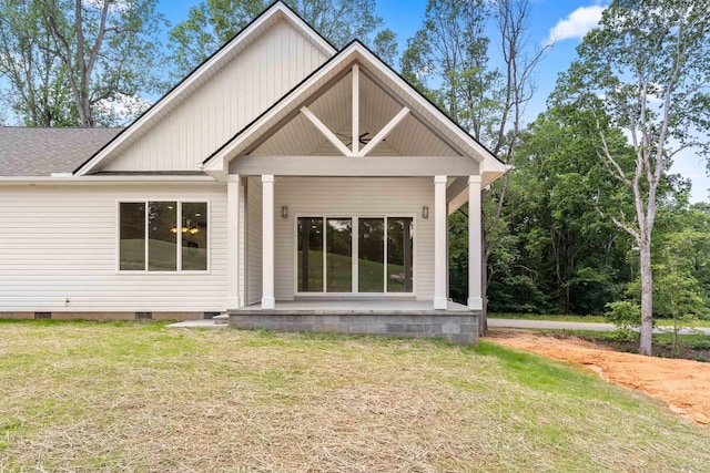 3135 E Croft Cir, Spartanburg, SC 29302 - back of property featuring a yard, crawl space, a shingled roof, and covered porch