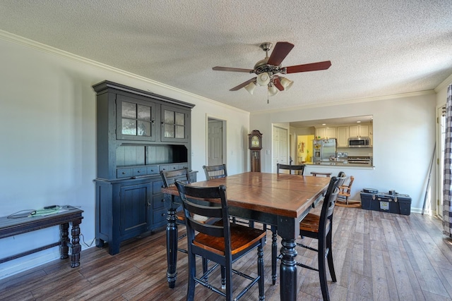 955 Baggett Rd, Enoree, SC 29335 - dining room with ceiling fan, a textured ceiling, dark wood-style floors, and crown molding