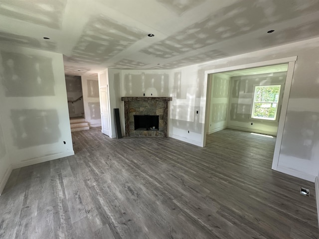 1320 Shoresbrook Rd, Spartanburg, SC 29301 - unfurnished living room with stairway, dark wood-type flooring, and a fireplace