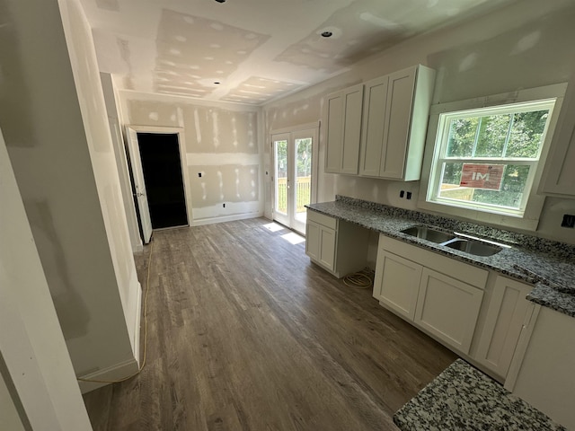 1320 Shoresbrook Rd, Spartanburg, SC 29301 - kitchen featuring dark wood-type flooring, dark stone counters, french doors, and white cabinetry