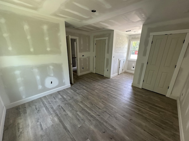 1320 Shoresbrook Rd, Spartanburg, SC 29301 - unfurnished bedroom with multiple closets and wood finished floors
