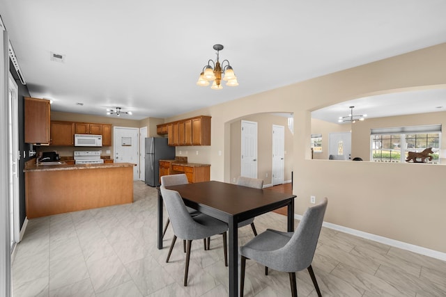 100 Maximus Dr, Greer, SC 29651 - dining space featuring a chandelier and arched walkways